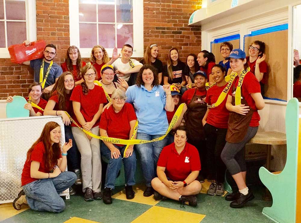 Herrell's® employees with yellow caution tape